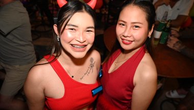 DZ6_2275: Devilish smiles and red-hot energy - a night out with friends in full festive spirit.